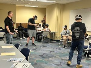 Photo of several students using Virtual Reality Career Exploration technology.